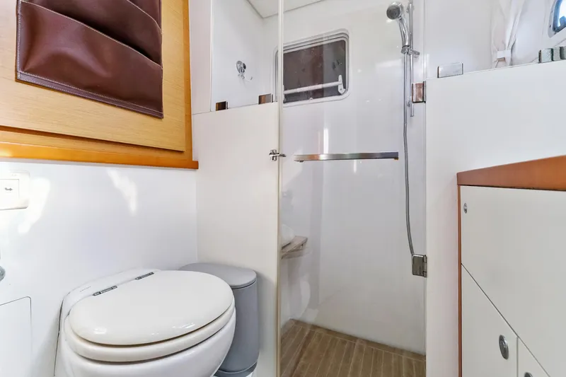 Slide: The Image of Interior of 2012 Lagoon 560 yacht bathroom with shower and toilet. - 93