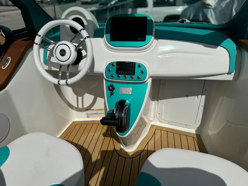 Slide: The Image of Interior of 2025 Car Off-shore Fiat 500 Classic with modern dashboard and steering wheel. - 20