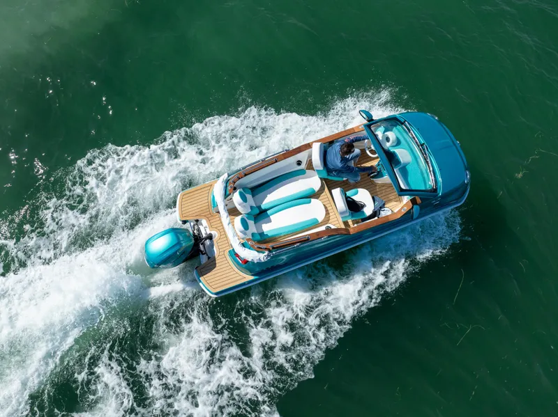 Slide: The Image of Aerial view of 2025 Car Off-shore Fiat 500 Classic boat on water. - 9