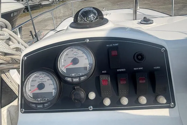 Slide: The Image of Control panel of a 2012 Boston Whaler 210 Montauk boat with gauges and switches. - 13
