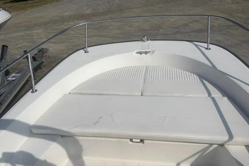 Slide: The Image of 2012 Boston Whaler 210 Montauk boat bow with seating and railings. - 16