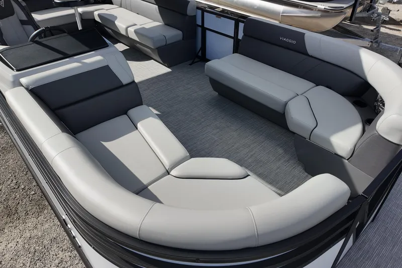 Slide: The Image of Luxurious seating on 2026 Viaggio Lago V 20 C pontoon boat, featuring sleek gray upholstery. - 13