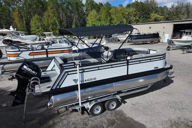 Slide: The Image of 2026 Viaggio Lago V 20 C pontoon boat with Suzuki engine on trailer. - 2