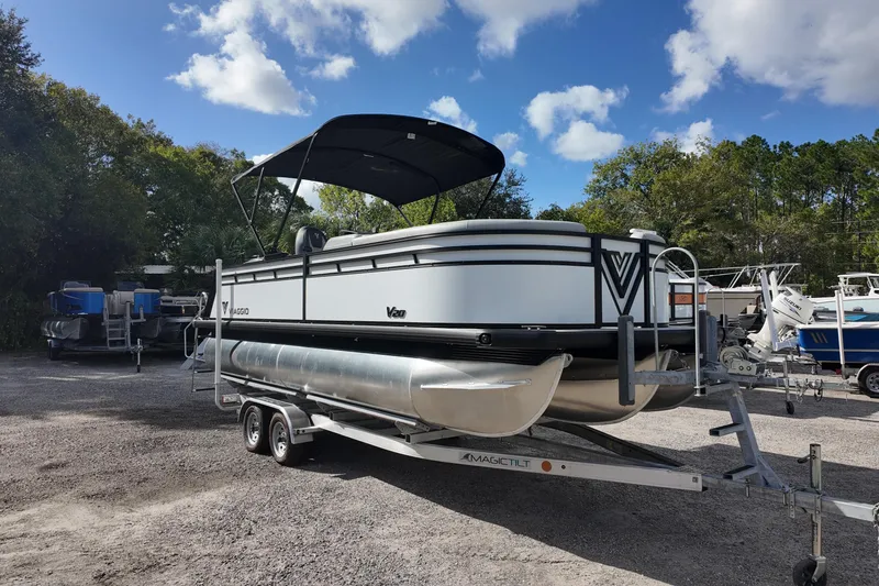 Slide: The Image of 2026 Viaggio Lago V 20 C pontoon boat on trailer under blue sky. - 3