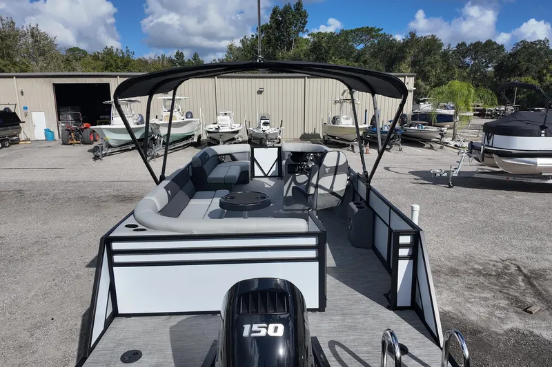 Slide: The Image of 2026 Viaggio Lago V 20 C pontoon boat with canopy in a marina setting. - 5