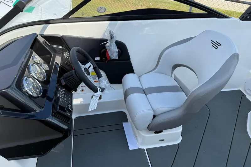 Slide: The Image of 2025 Bayliner V20i boat cockpit with modern steering and comfortable seating. - 10