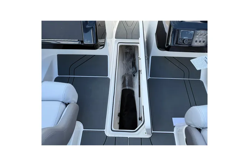 Slide: The Image of 2025 Bayliner V20i boat interior with storage compartment and seating. - 16