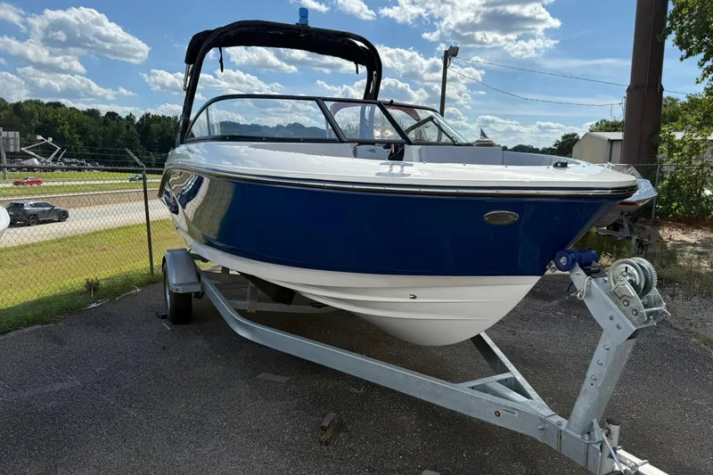 Slide: The Image of 2025 Bayliner V20i boat on trailer under a sunny sky. - 3