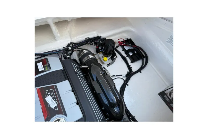 Slide: The Image of Engine compartment of 2025 Bayliner V20i boat, showcasing modern components and wiring. - 8