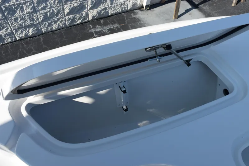 Slide: The Image of Open storage compartment on 2026 Sea Hunt BX 22 BR boat. - 12