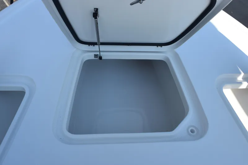 Slide: The Image of Open storage compartment on 2026 Sea Hunt BX 22 BR boat. - 13