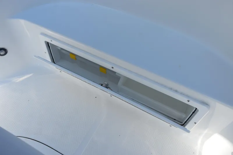 Slide: The Image of 2026 Sea Hunt BX 22 BR boat storage compartment, open and empty. - 16
