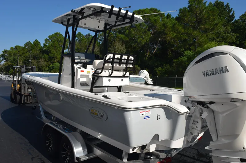 Slide: The Image of 2026 Sea Hunt BX 22 BR boat with Yamaha engine, parked outdoors. - 5