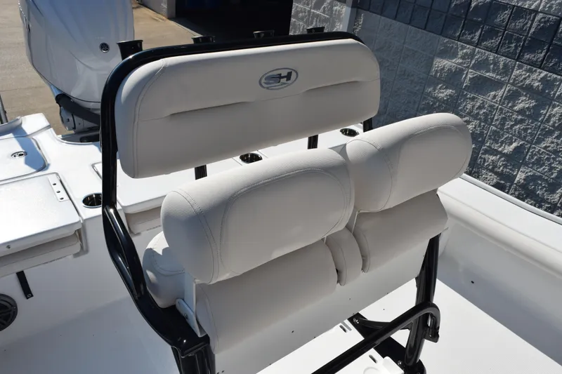 Slide: The Image of 2026 Sea Hunt BX 22 BR boat with white cushioned seating and black frame. - 8