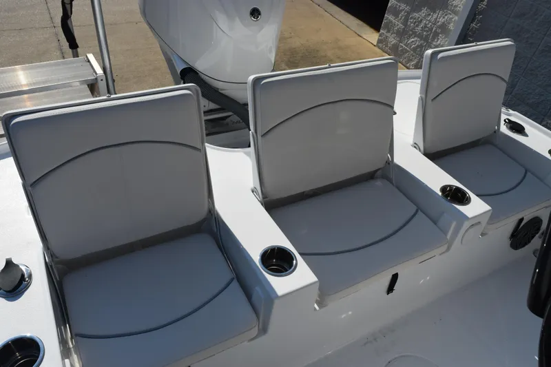 Slide: The Image of 2026 Sea Hunt BX 22 BR boat with three cushioned seats and cup holders. - 9
