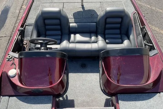 Slide: The Image of 2000 Ranger 518SVX Comanche boat interior with dual seats and steering wheel. - 11