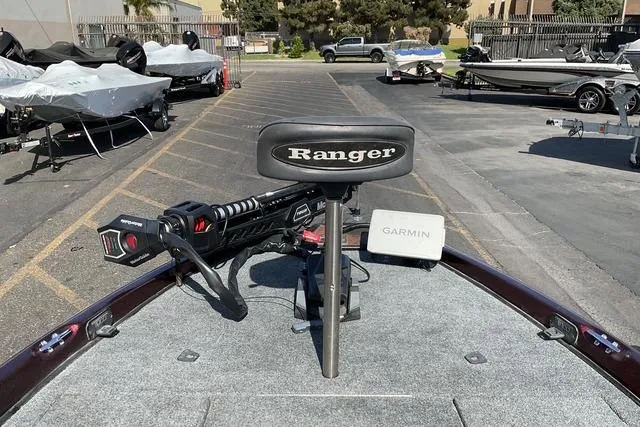 Slide: The Image of 2000 Ranger 518SVX Comanche boat with Garmin equipment, parked in a lot. - 9