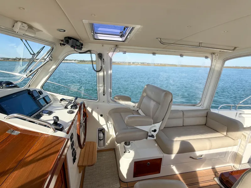 Slide: The Image of 2015 MJM 36z Downeast yacht interior with helm, seating, and ocean view. - 21