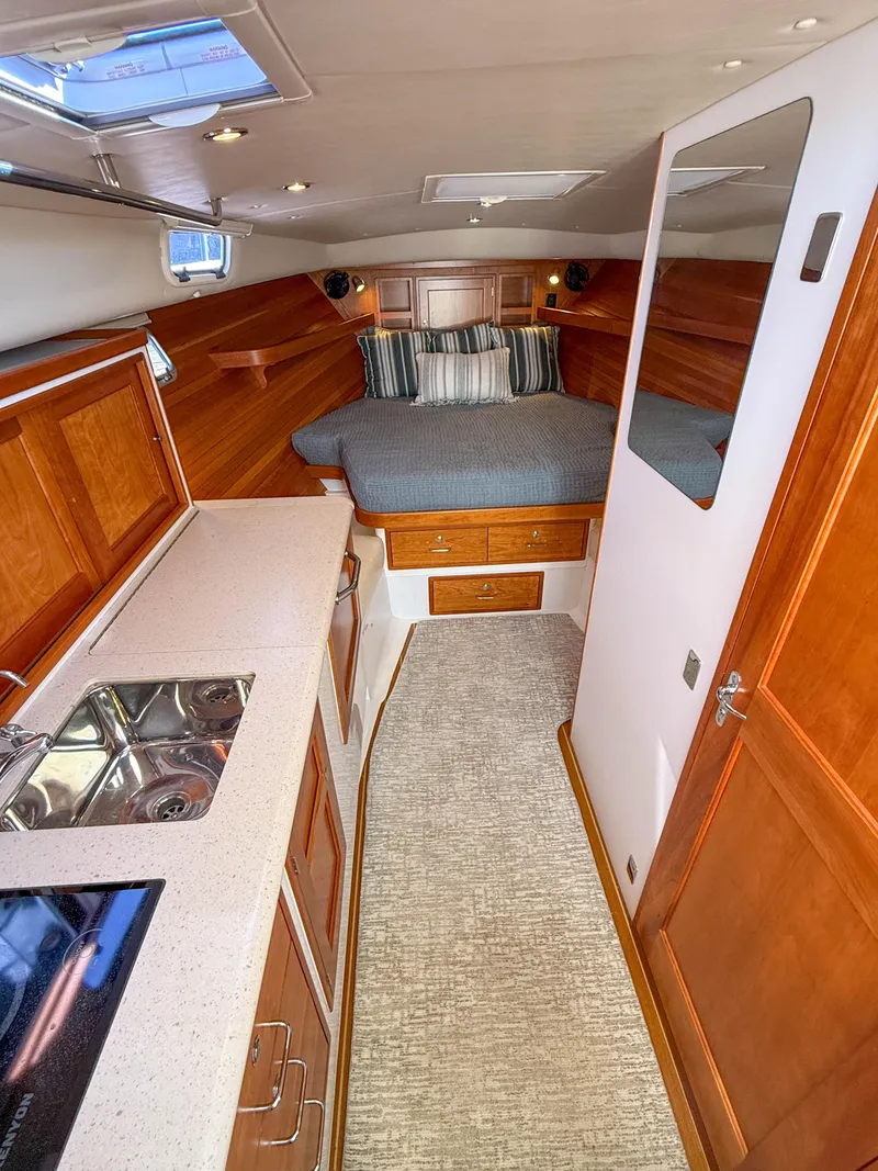 Slide: The Image of 2015 MJM 36z Downeast yacht interior with kitchen and cozy sleeping area. - 26
