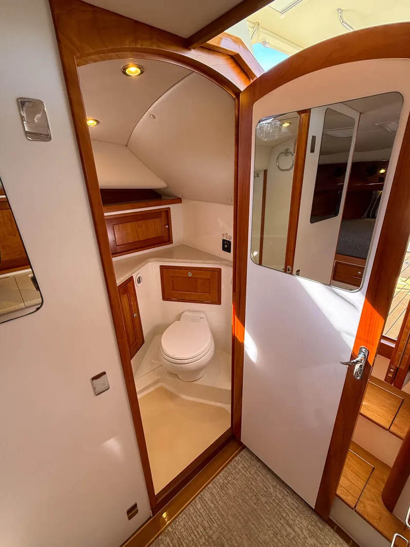 Slide: The Image of 2015 MJM 36z Downeast yacht bathroom with wooden cabinetry and modern fixtures. - 35