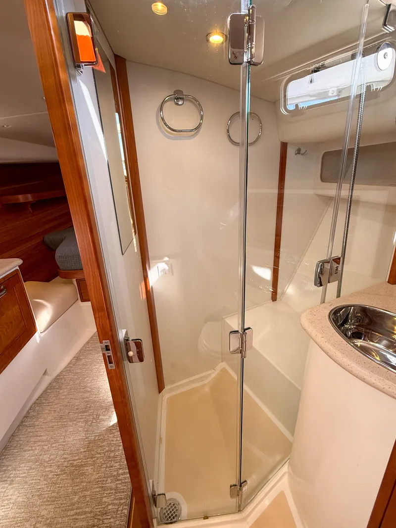 Slide: The Image of 2015 MJM 36z Downeast yacht bathroom with glass shower and modern fixtures. - 37