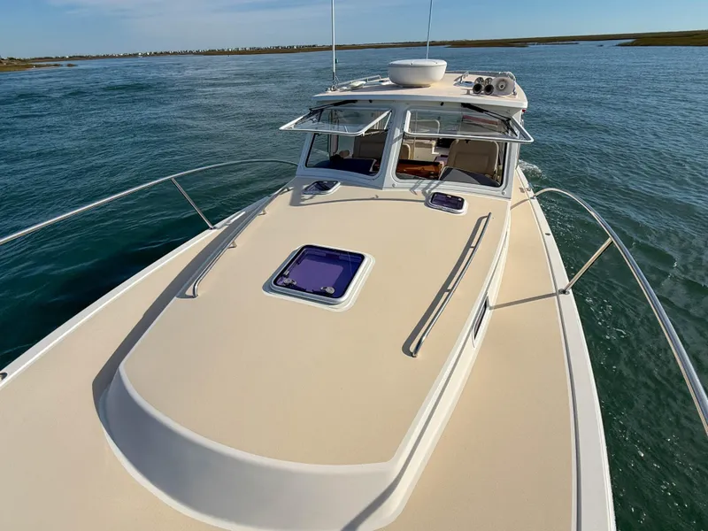 Slide: The Image of 2015 MJM 36z Downeast boat cruising on open water. - 41