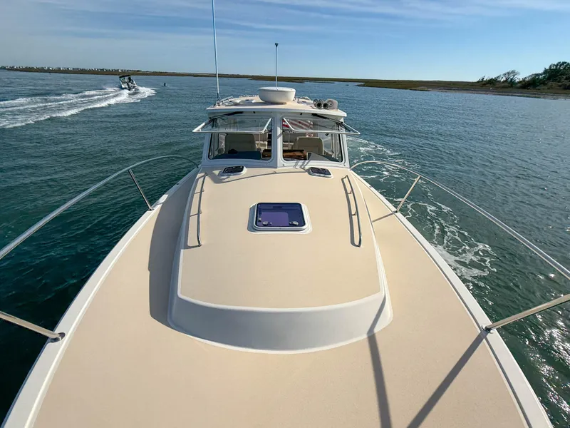 Slide: The Image of 2015 MJM 36z Downeast boat cruising on open water. - 42