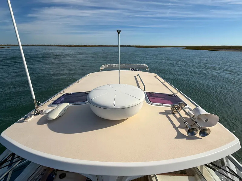 Slide: The Image of 2015 MJM 36z Downeast boat deck with clear sky and calm waters. - 46