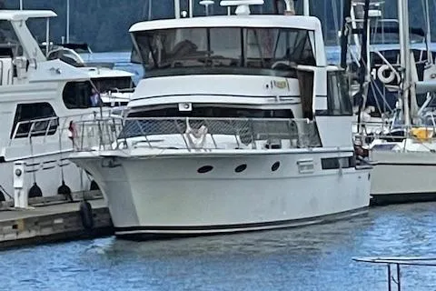 Slide: The Image of 1991 Californian 52 Cockpit Motor Yacht docked at marina, surrounded by other boats. - 2