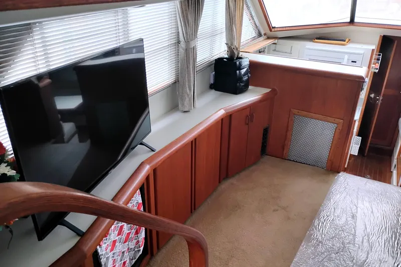 Slide: The Image of Interior of 1991 Californian 52 Cockpit Motor Yacht with TV and wooden cabinetry. - 20