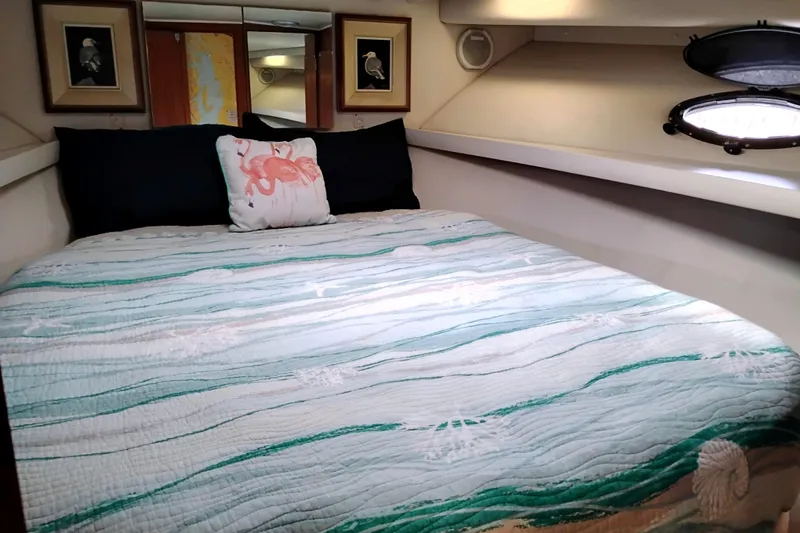 Slide: The Image of Cozy bedroom in 1991 Californian 52 Cockpit Motor Yacht with nautical decor. - 38