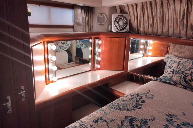 Slide: The Image of Luxurious bedroom vanity with lights in 1991 Californian 52 Cockpit Motor Yacht. - 47