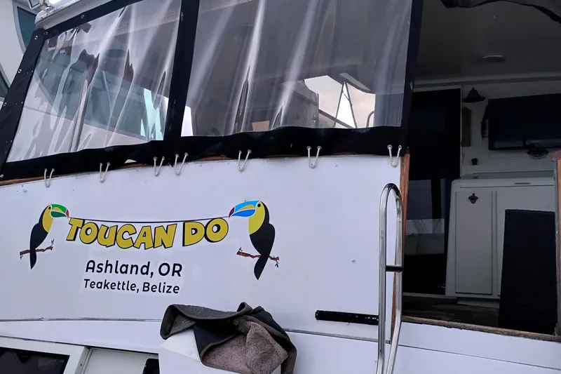 Slide: The Image of 1991 Californian 52 Cockpit Motor Yacht with "Toucan Do" signage, Ashland, OR, Teakettle, Belize. - 5