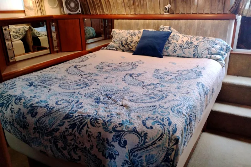 Slide: The Image of Luxurious bedroom in 1991 Californian 52 Cockpit Motor Yacht with elegant bedding. - 51