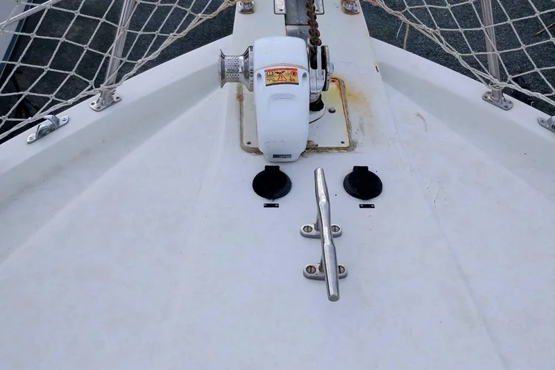 Slide: The Image of Bow of 1991 Californian 52 Cockpit Motor Yacht with anchor winch and cleat. - 58
