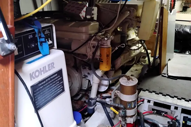 Slide: The Image of Engine room of 1991 Californian 52 Cockpit Motor Yacht with Kohler generator. - 64