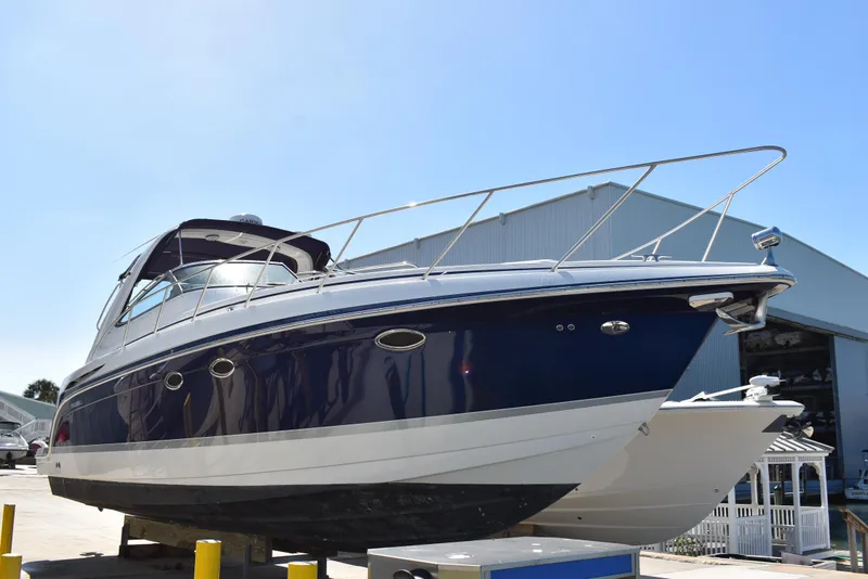 The Image of 2005 Formula 37 PC yacht on dry dock, blue and white hull. - 0