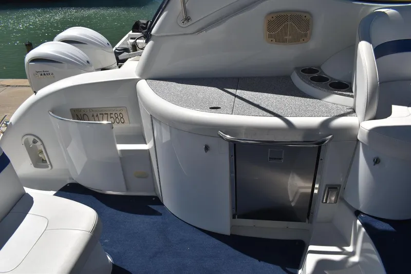 Slide: The Image of 2005 Formula 37 PC boat interior with seating and storage compartments. - 10