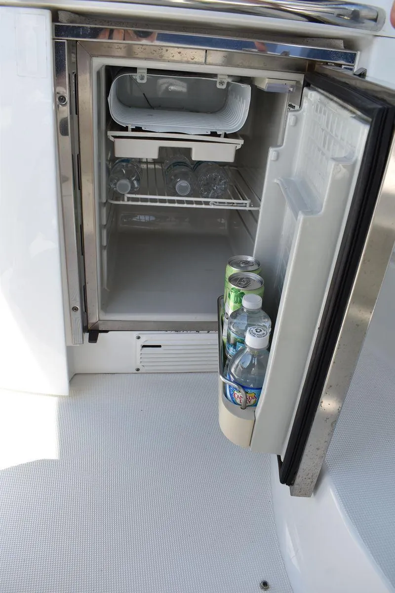 Slide: The Image of Open mini fridge on 2005 Formula 37 PC boat with drinks inside. - 11