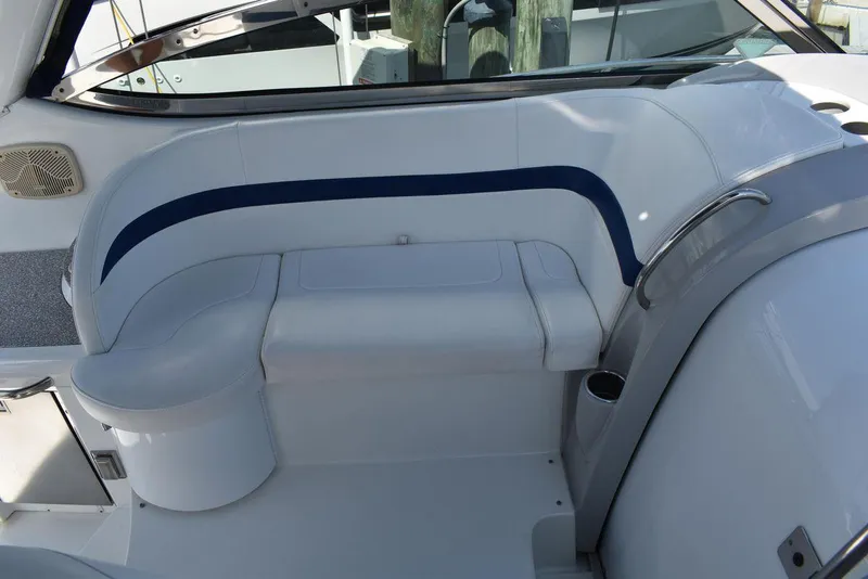 Slide: The Image of 2005 Formula 37 PC boat interior seating area with white and blue upholstery. - 12