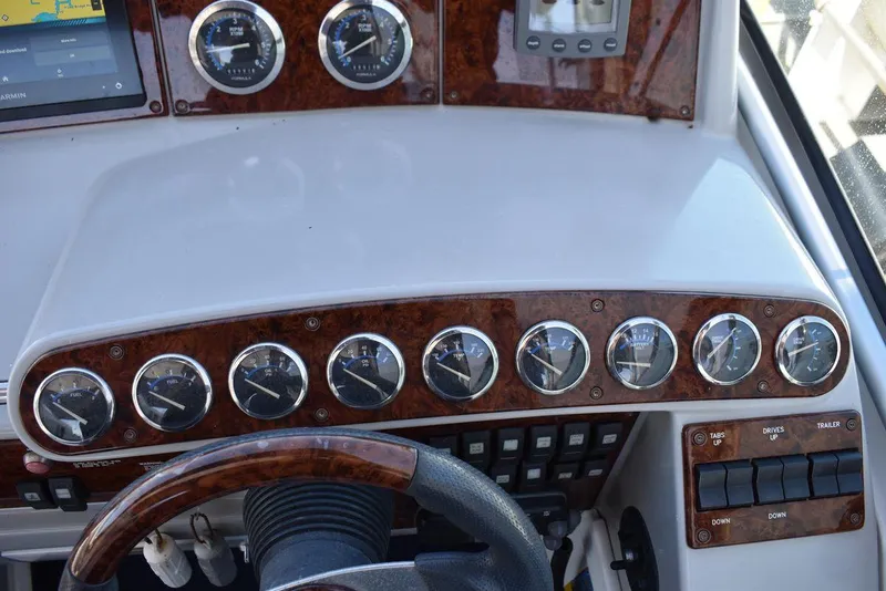 Slide: The Image of Dashboard of a 2005 Formula 37 PC boat with multiple gauges and controls. - 17