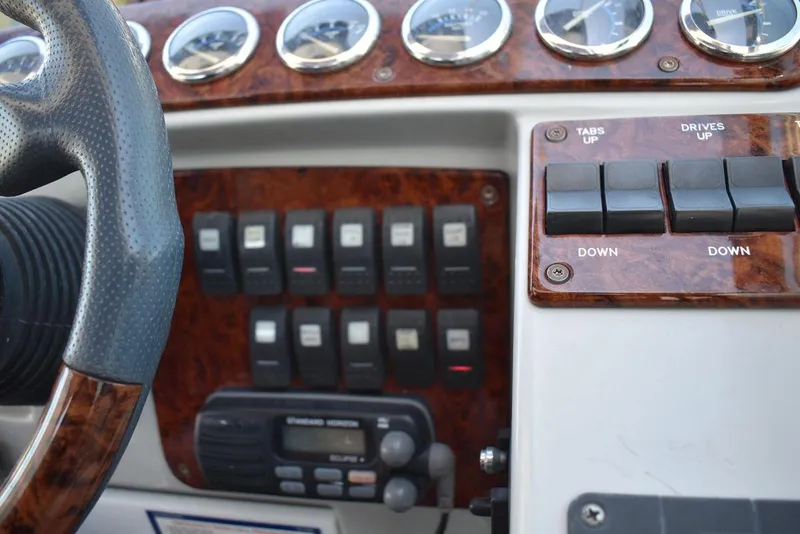 Slide: The Image of 2005 Formula 37 PC boat dashboard with controls and gauges. - 18