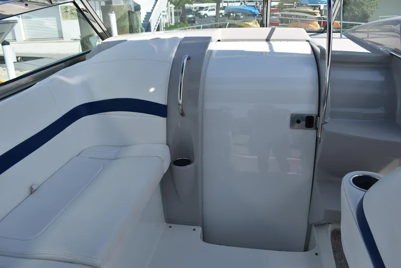 Slide: The Image of Interior seating area of a 2005 Formula 37 PC boat with white and blue upholstery. - 27