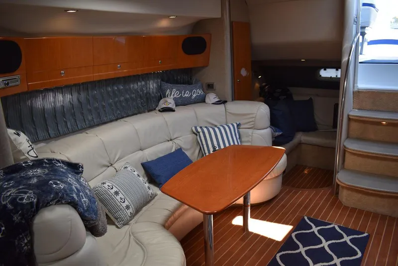 Slide: The Image of Luxurious interior of a 2005 Formula 37 PC yacht with plush seating and wooden table. - 28