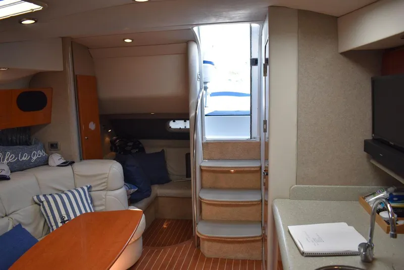 Slide: The Image of Interior of 2005 Formula 37 PC yacht with cozy seating and stairs to deck. - 29