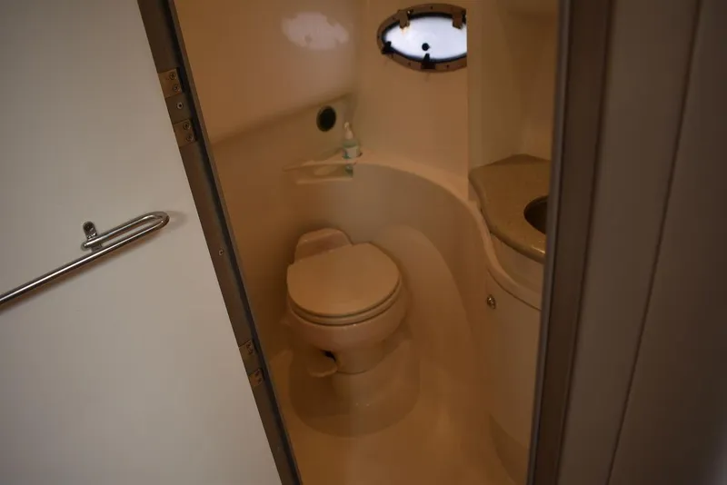Slide: The Image of 2005 Formula 37 PC boat bathroom with toilet and sink. - 34