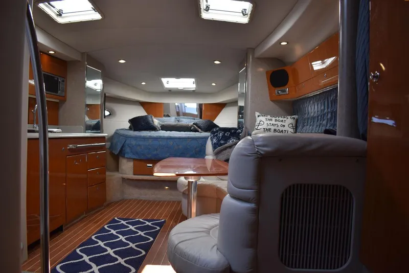 Slide: The Image of Interior of a 2005 Formula 37 PC yacht with modern amenities and cozy sleeping area. - 35