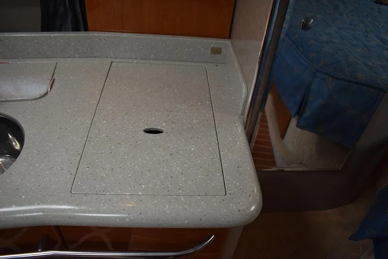 Slide: The Image of 2005 Formula 37 PC boat interior countertop with sink cover. - 38