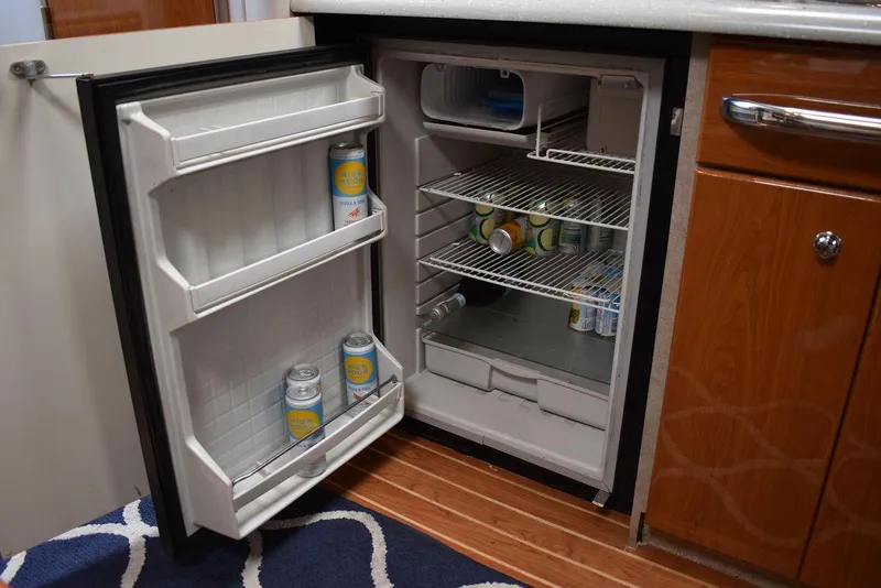 Slide: The Image of Open mini fridge in 2005 Formula 37 PC boat galley with drinks inside. - 41