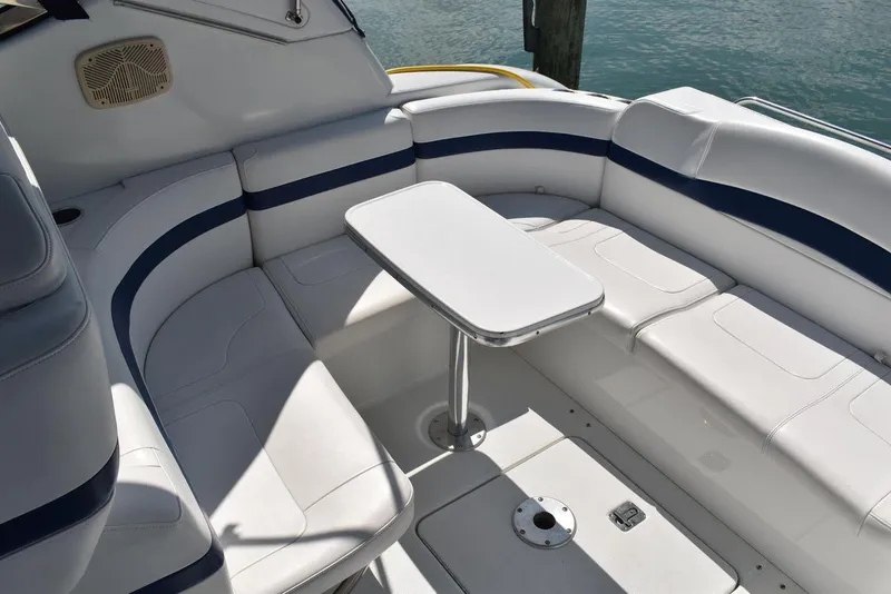 Slide: The Image of 2005 Formula 37 PC boat interior with white and blue seating and table. - 7